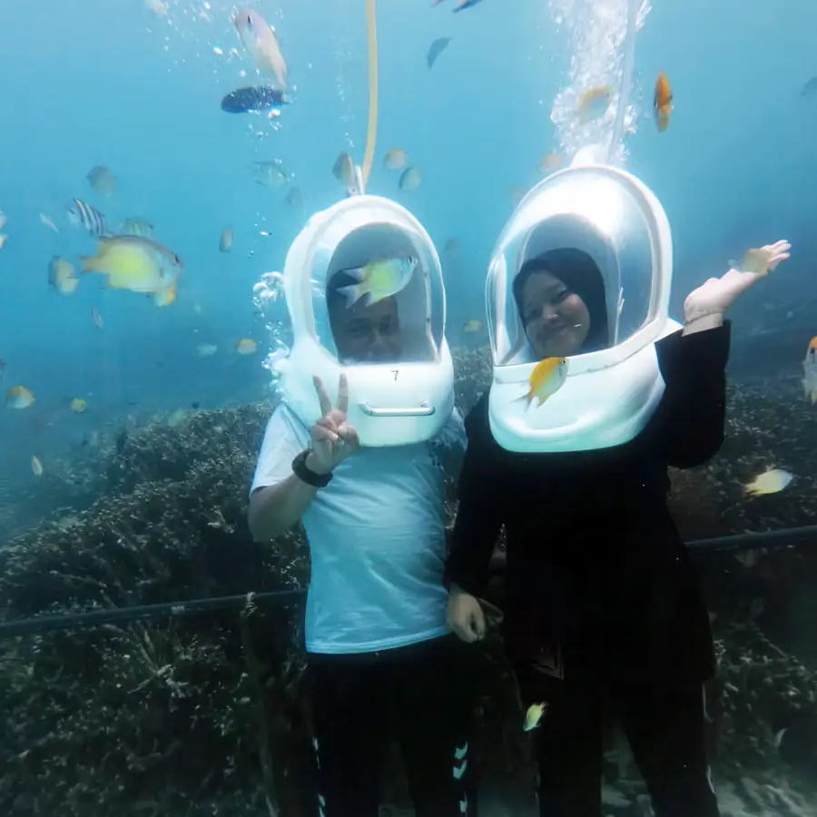 Unique underwater bubble walking activity for guests Adil Waterhouse Resort
