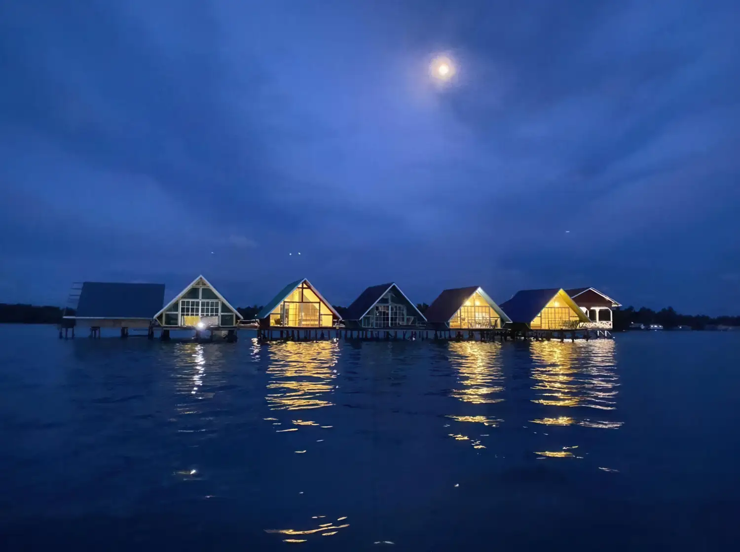 Scenic view of the overwater wooden chalets Adil Waterhouse Resort